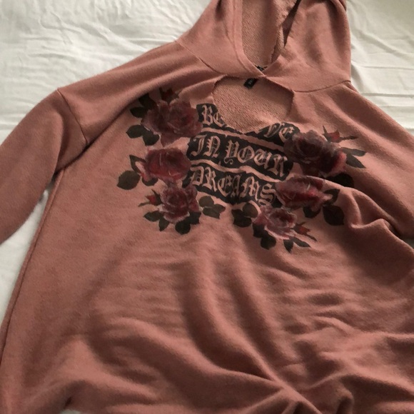 A hooded shirt with a hole in the front - Picture 2 of 3